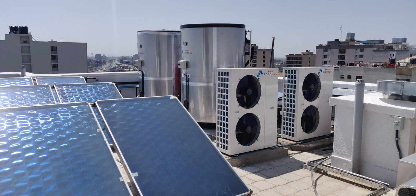 solar water heaters and heat pumps on the roof of a building
